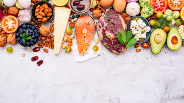 istock Ketogenic low carbs diet concept. Ingredients for healthy foods selection set up on white concrete background. 1349066310