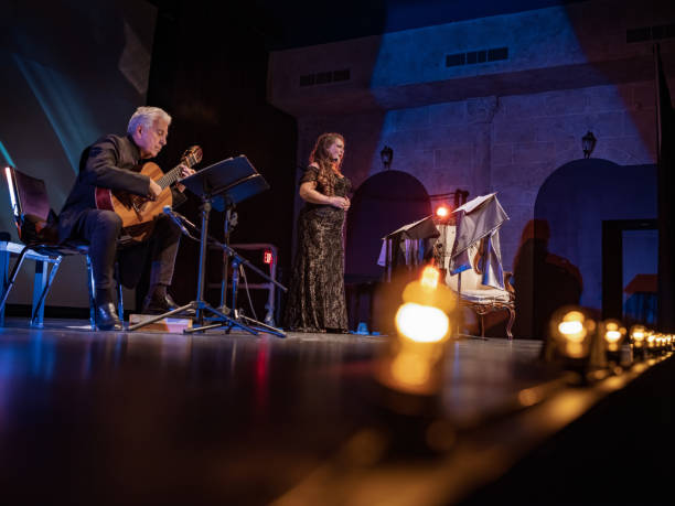 istock Mature Performer and Guitarist on the stage 1349066321