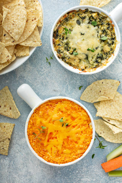 istock Artichoke spinach and buffalo chicken dips with chips 1349067633