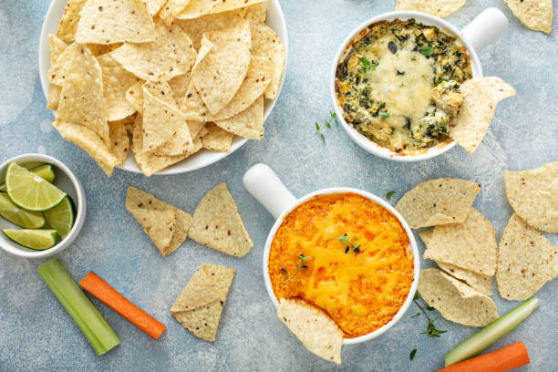 istock Artichoke spinach and buffalo chicken dips with chips 1349067638