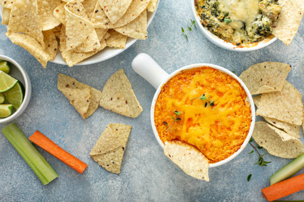 istock Artichoke spinach and buffalo chicken dips with chips 1349067639