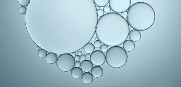 istock Abstract background of oil droplets on water creative art image and shape. 1349072261
