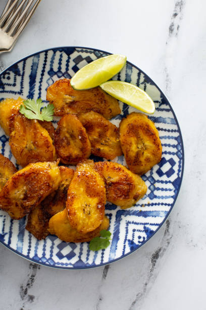 istock Fried caramelized plantains served with lime wedges 1349072478