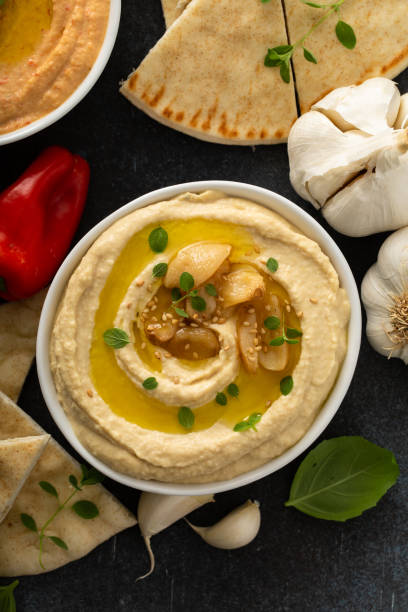 istock Roasted garlic hummus topped with olive oil 1349072496