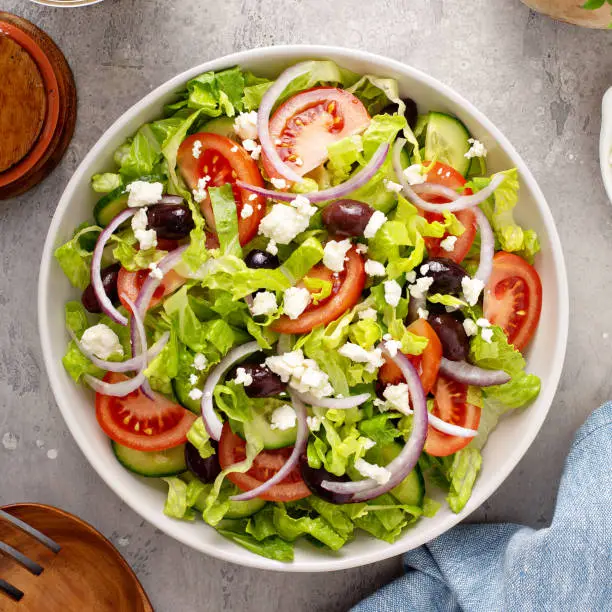 Photo of Vegetarian greek salad with vinaigrette dressing