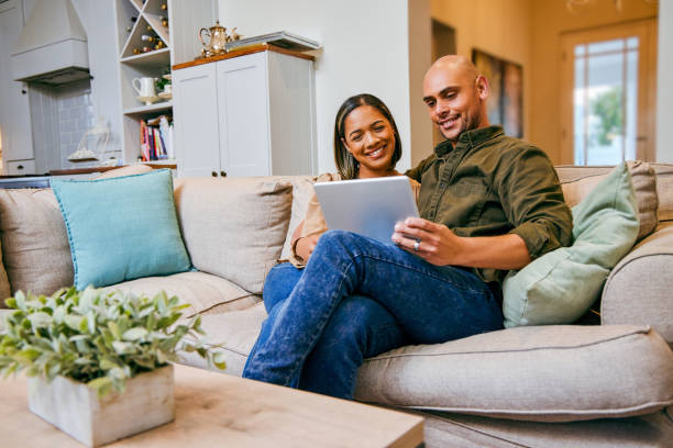 istock Shot of a young couple using their digital tablet together 1349073930