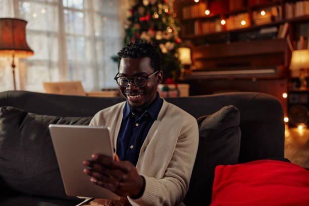 istock Black man enjoys some quality time with his smartest device 1349076668