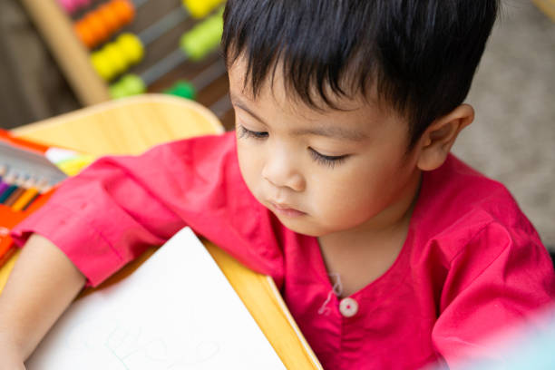 istock Adorable asian little boy at home exploring his surrounding 1349076742