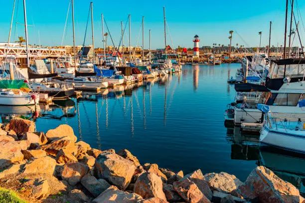 Oceanside Harbor is a  dramatic public harbor With Fishing Boats And Lighthouse. It is surrounded by small shops and is located next to Carlsbad, California.
