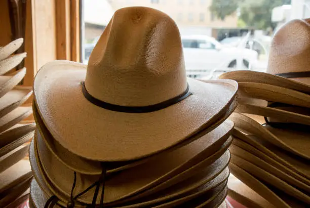 Photo of Pile of cowboy hats for sale at shop in Austin, Texas
