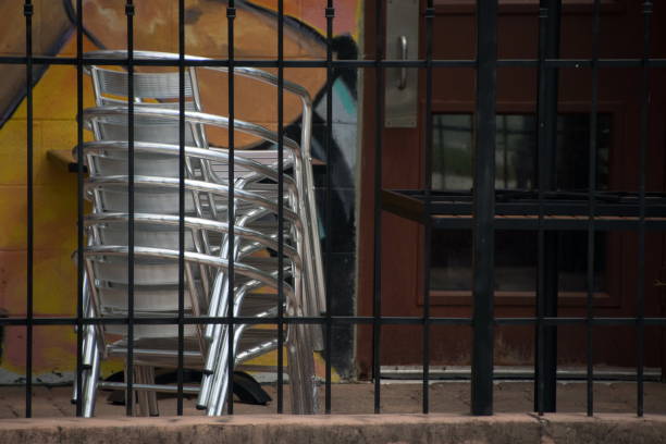 Stack of metal chairs in closed cafe in SoCo, Austin, Texas