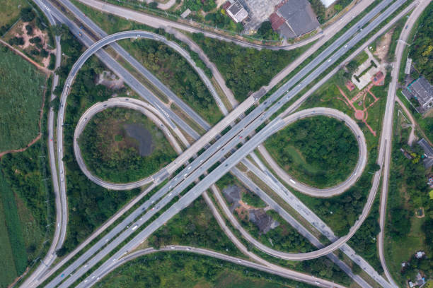 istock Aerial view of highway junctions with roundabout. Bridge roads shape circle in structure of architecture and transportation concept. Top view. Urban city, Bangkok at sunset, Thailand 1349089990