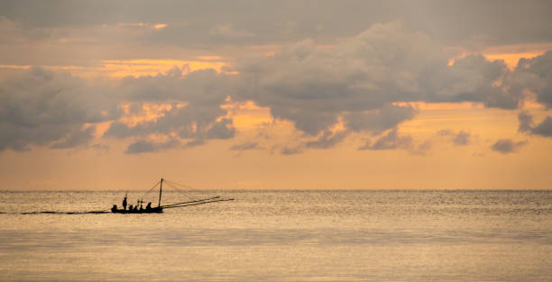 istock Fishing boat at sunset 1349090716