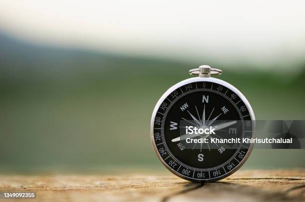 Classic Compass On A Wooden Vintage With A Green Background Compass For A Symbol Of Tourism With Compass Travel With A Compass Life Direction Concept Stock Photo - Download Image Now