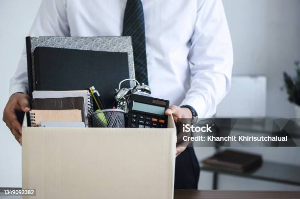 Businessmen Hold Boxes For Personal Belongings And Resignation Letters For Resign By The Desk In The Office For Changing And Resigning From Work Concept For Quit Or Change Of Job Stock Photo - Download Image Now
