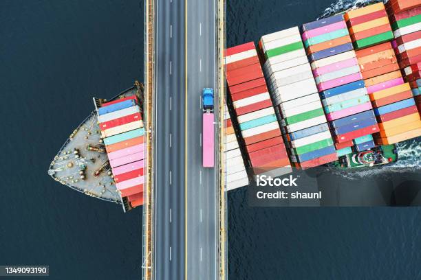 Container Ship Beneath Bridge Stock Photo - Download Image Now - Freight Transportation, Delivering, Shipping