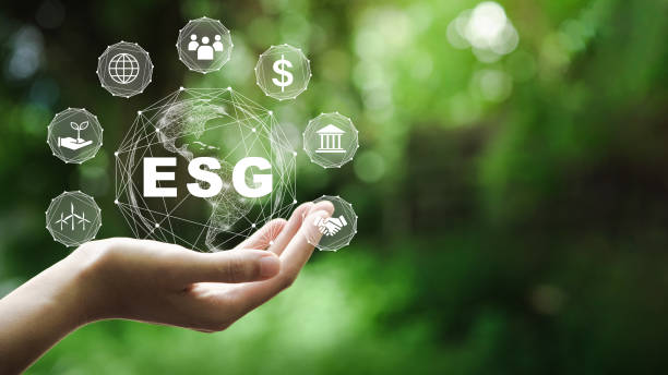 esg icon concept in the hand for environmental, social, and governance in sustainable and ethical business on the network connection on a green background. - esg stockfoto's en -beelden