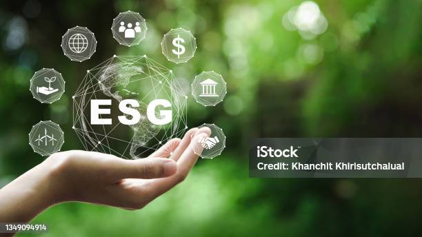 Esg Icon Concept In The Hand For Environmental Social And Governance In Sustainable And Ethical Business On The Network Connection On A Green Background Stock Photo - Download Image Now