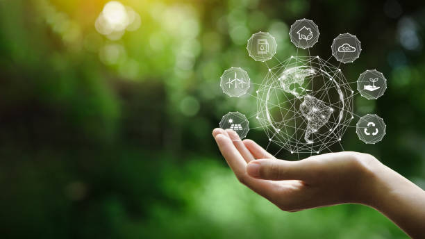 hand-holding with environment icons over the network connection on a green background to technology and environmental protection, renewable, sustainable energy sources. - friendly match imagens e fotografias de stock