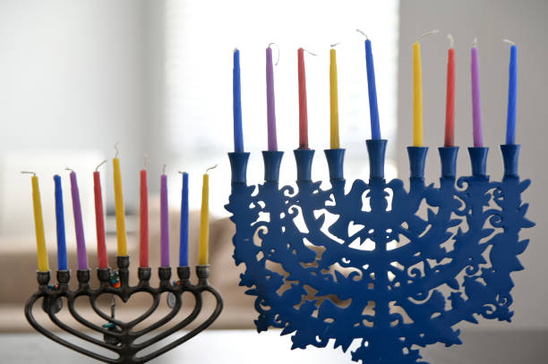 istock Two candelabrum with nine branches and colorful candles 1349094960