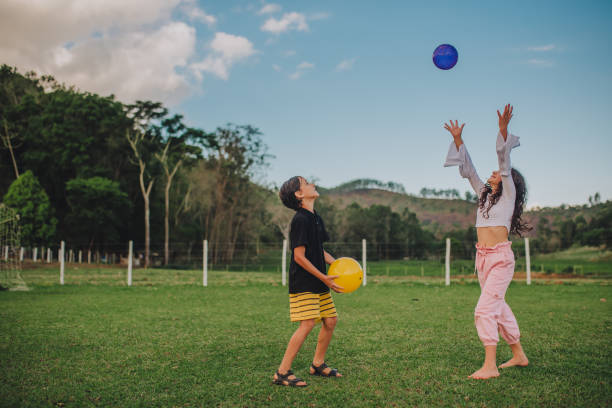 istock brothers playing outdoors 1349095976