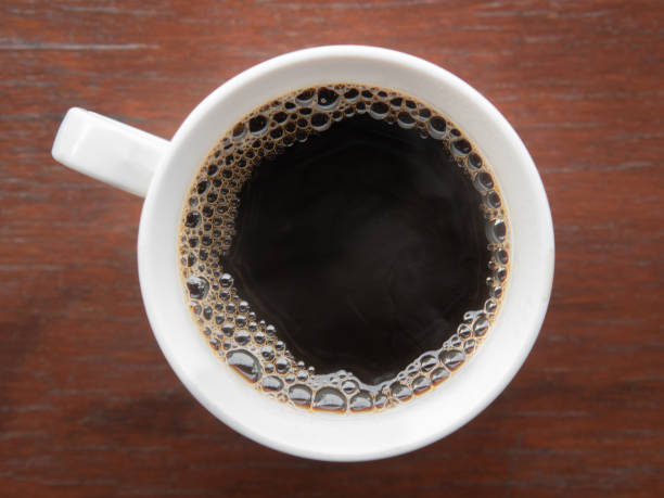 istock Hot Americano coffee in a mug on a wooden board. 1349098551