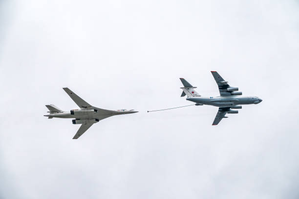 The group of supersonic strategic bomber of long-range aviation Tu-160 and flying tanker Il-78m fly over the Red Square Moscow, Russia - May, 09, 2021: The group of supersonic strategic bomber of long-range aviation Tu-160 and flying tanker Il-78m fly over the Red Square. Tu-160 and IL-78M in the skies over Moscow tu160 stock pictures, royalty-free photos & images