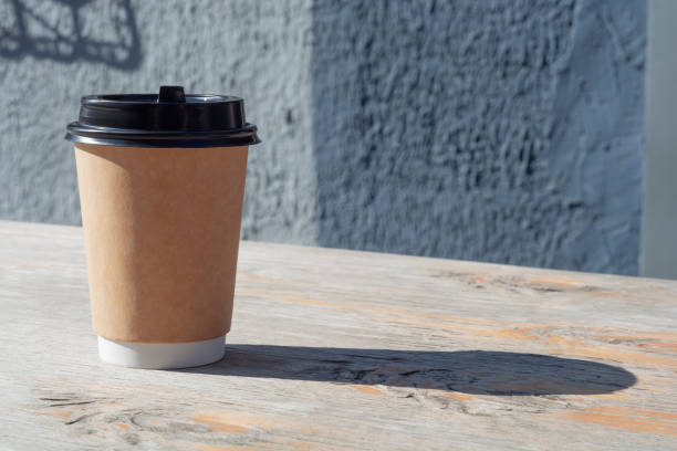 istock Coffee Paper Cup on Wooden Table. 1349102414