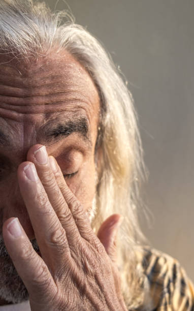 istock Portrait old man bringing hand to face 1349105401