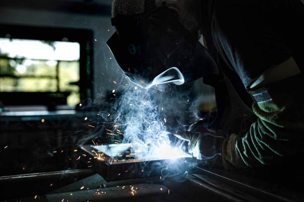 istock Steel worker grinding metal in a workshop. 1349109361