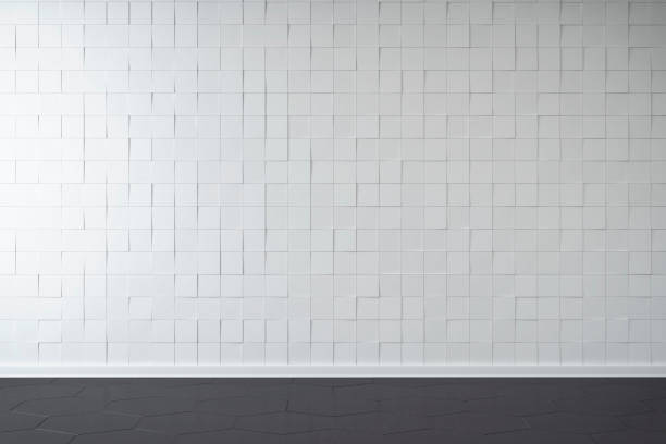 istock Empty unfurnished interior with white tiled wall background and gray tiled floor 1349110402