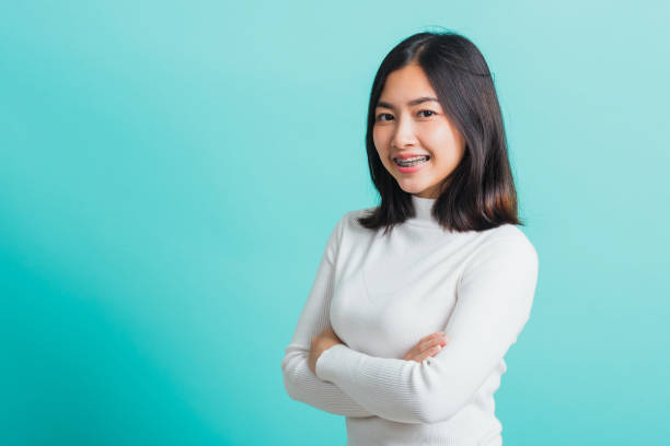 istock woman smiling with crossed arms 1349112650