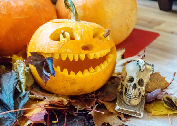 istock orange halloween pumpkin with carved traditional face, 1349114947