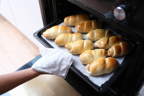 istock Buns are baked in the oven, check readiness 1349116350
