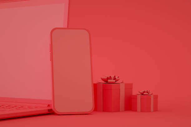 istock Blank screen mobile smart phone and laptop with gift boxes, online shopping 1349116484