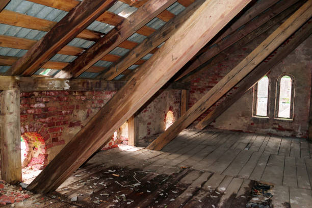 Attic with exposed beams and roof windows