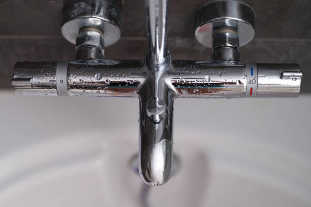 istock Steel mixer with a temperature sensor in the bathroom, close-up 1349116649