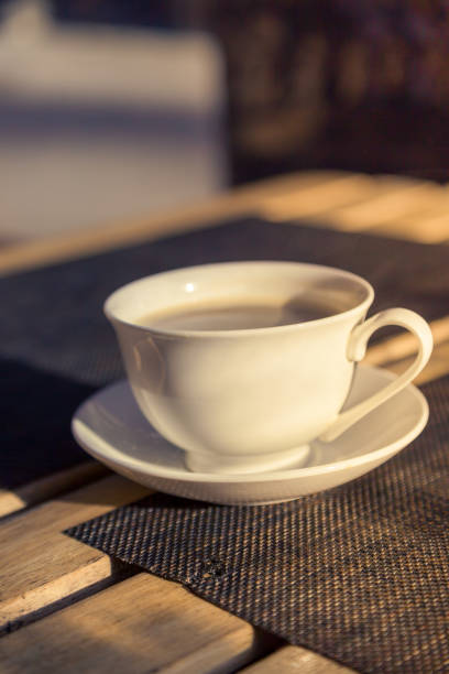 istock white cup on a saucer with black coffee 1349117603