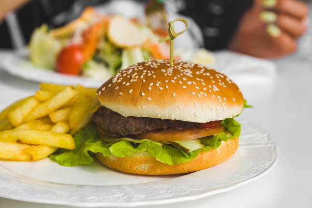 istock hamburger or cheeseburger with fries on a plate 1349119750