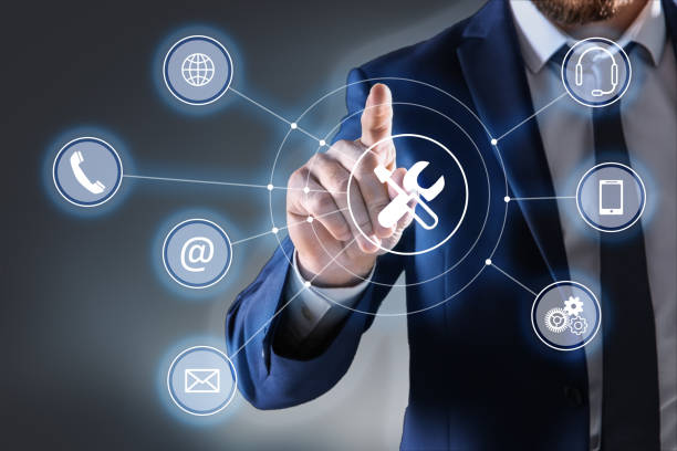 istock Businessman touching icon on virtual screen against dark background, closeup. Technical support 1349121533