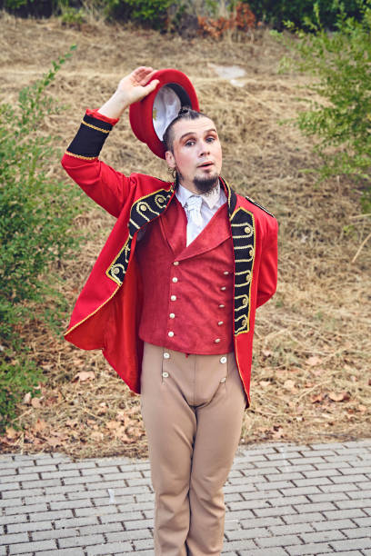 istock Male juggler with hat in park 1349121589