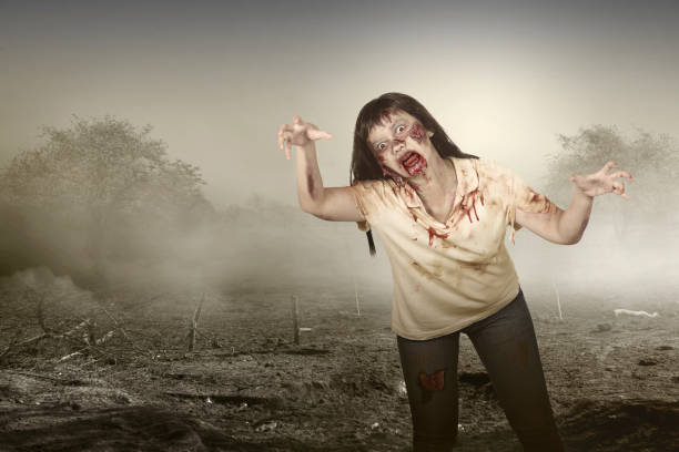 istock Scary zombie with blood and wound on his body walking 1349123905