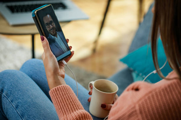 istock Virtually having a cup of coffee with a friend over a video call 1349124470