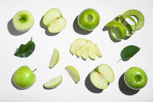 Fresh ripe green apples on white background, top view