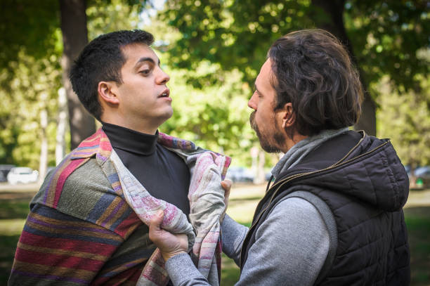 Two very angry, nervous and upset men in an aggressive and fierce quarrel conflict on the verge of a physical confrontation and a fight. Concept of male conflict