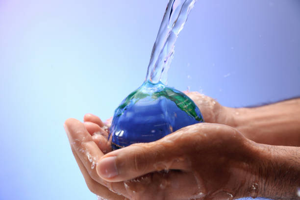 istock Water pouring on planet earth 1349128484