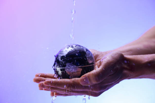 istock Water pouring on planet earth 1349128514