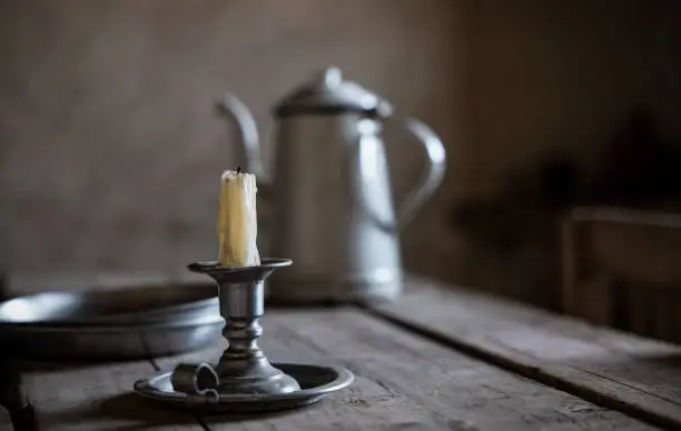 Old candle holder on wooden table