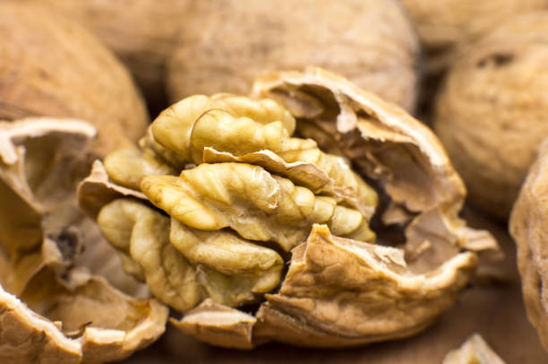 istock Crushed Walnut on the wood background. Close up. 1349133218