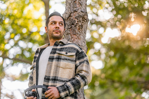 A portrait of a handsome man in nature.